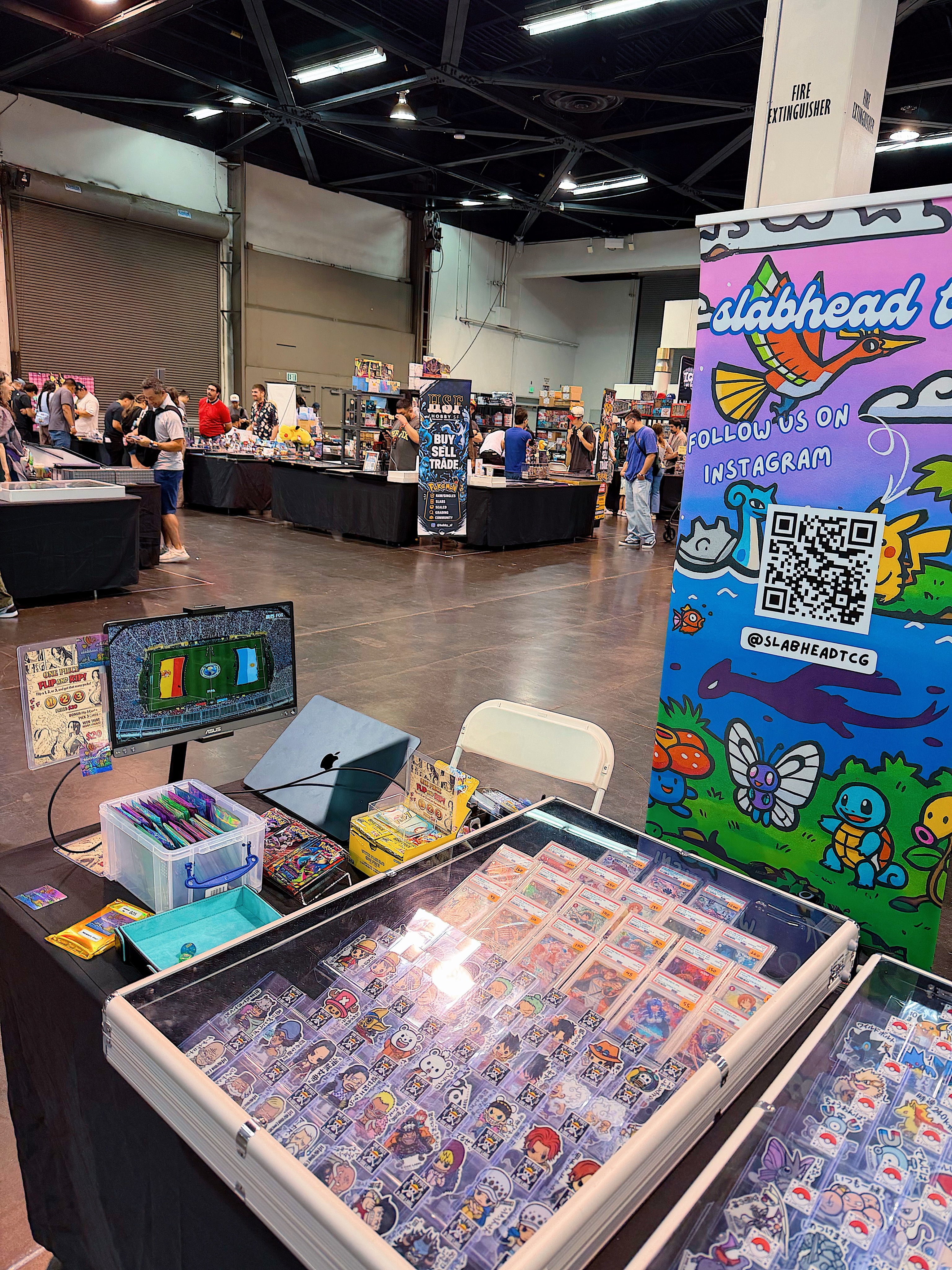 Rows of priced Pokemon and One Piece singles